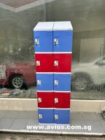 Colorful red and blue plastic lockers in a modern public storage area.